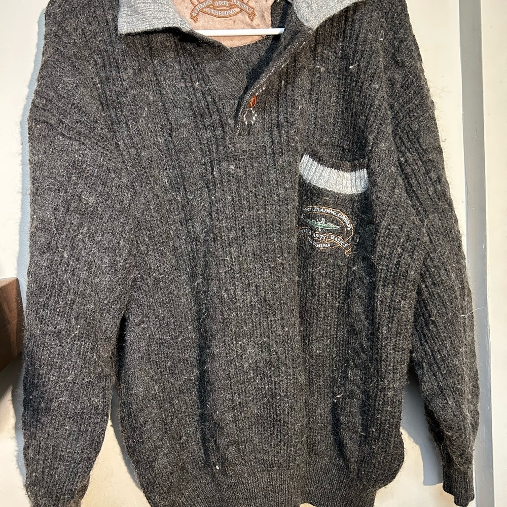 This vintage grey knit cardigan is from the brand Western Trading Company.